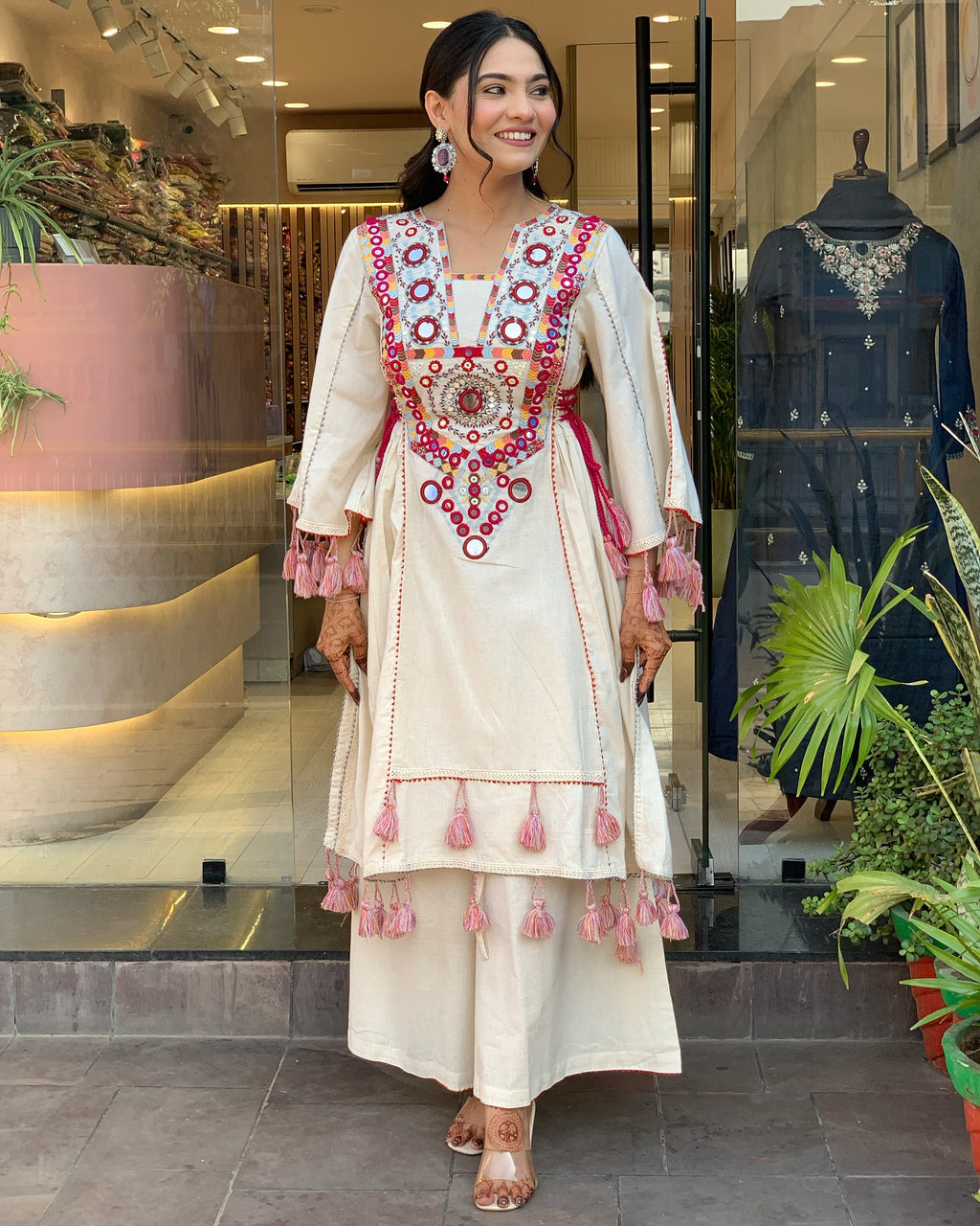 Exquisite Off-White Mirror Work Flex Cotton Kurta Set with Tassel Details
