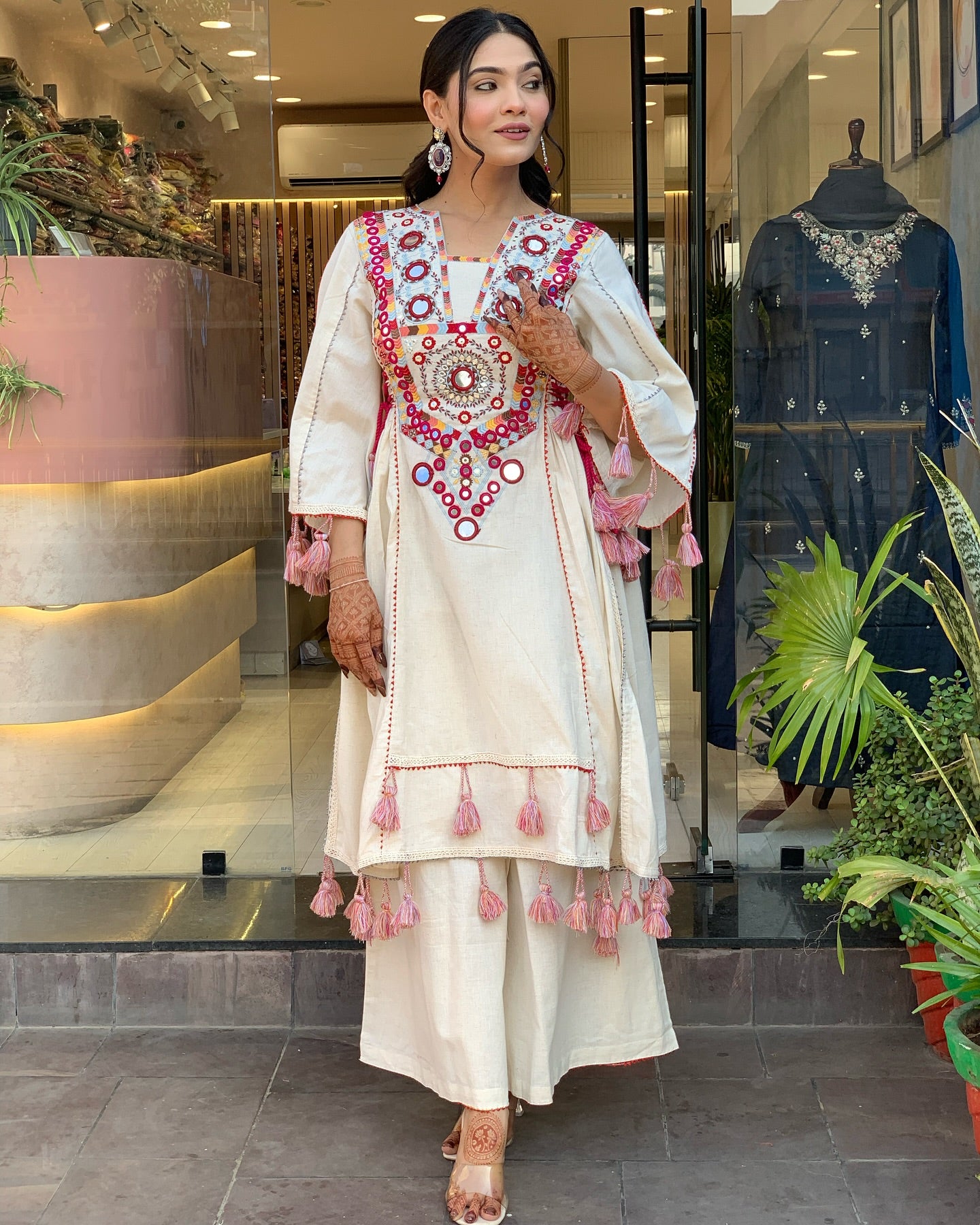 Exquisite Off-White Mirror Work Flex Cotton Kurta Set with Tassel Details